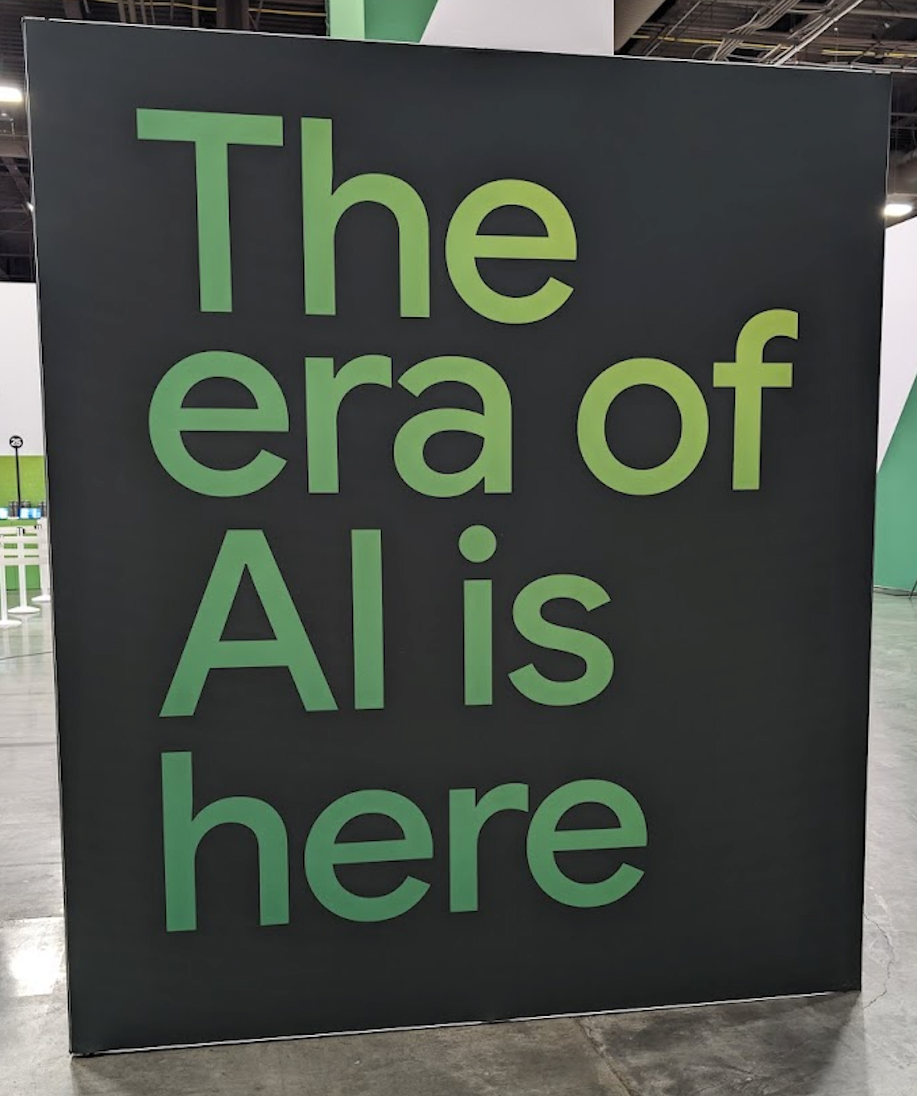 A sign saying "The era of AI is here"